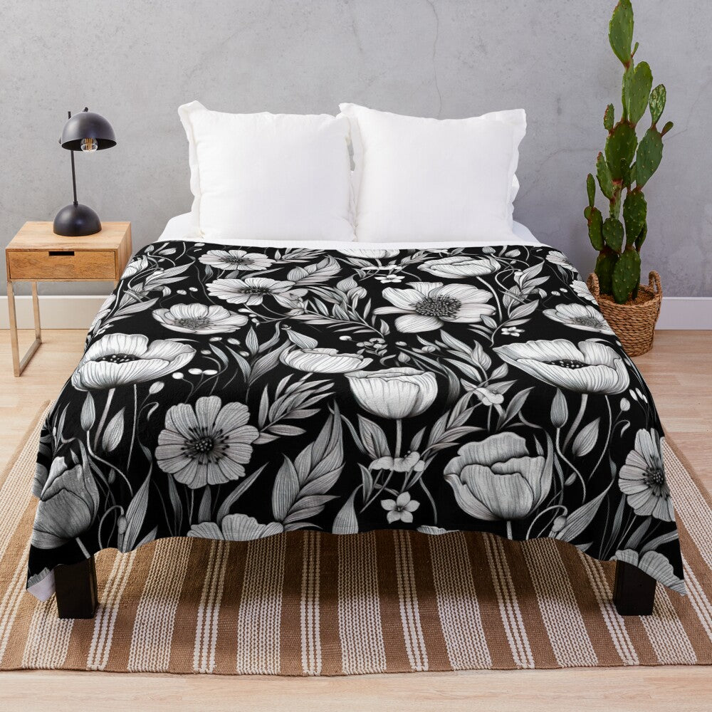 A cozy plush blanket featuring a beautiful black and white spring flower pattern