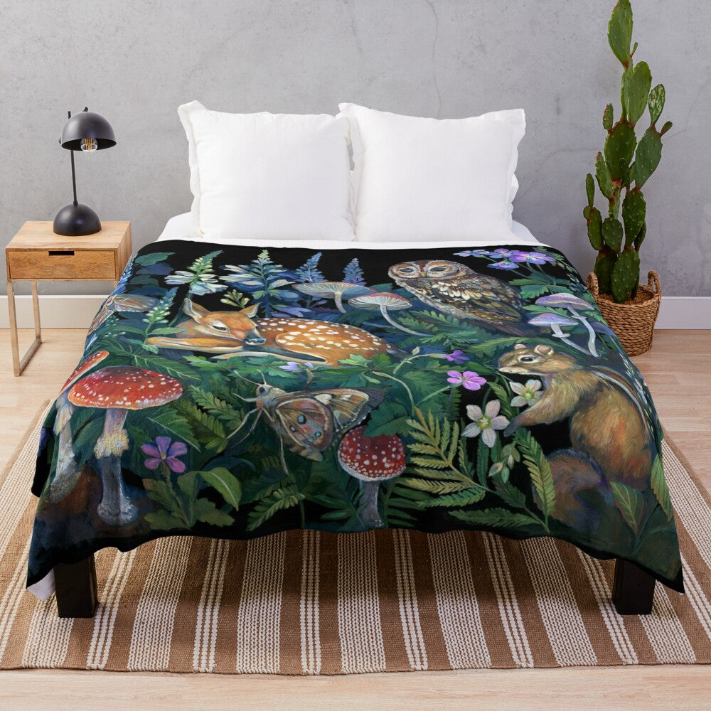 Enchanted forest plush blanket featuring wildlife and botanical designs