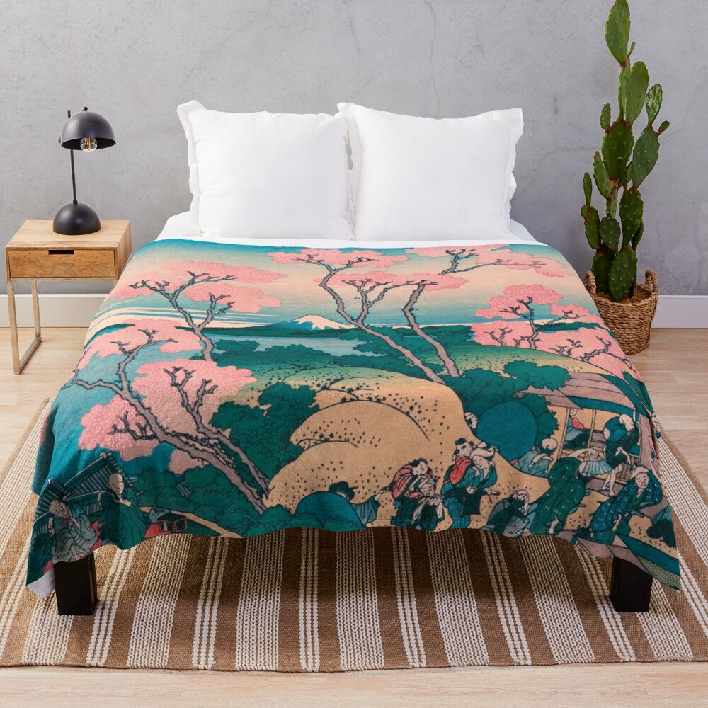 Spring picnic plush blanket with cherry blossom flowers and Mount Fuji in the background