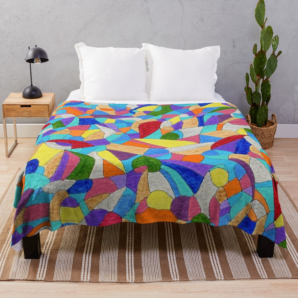 Colorful plush blanket featuring pebble patterns and abstract floral designs