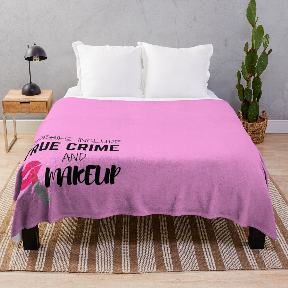 Plush blanket with text "My Hobbies Include True Crime and Makeup"