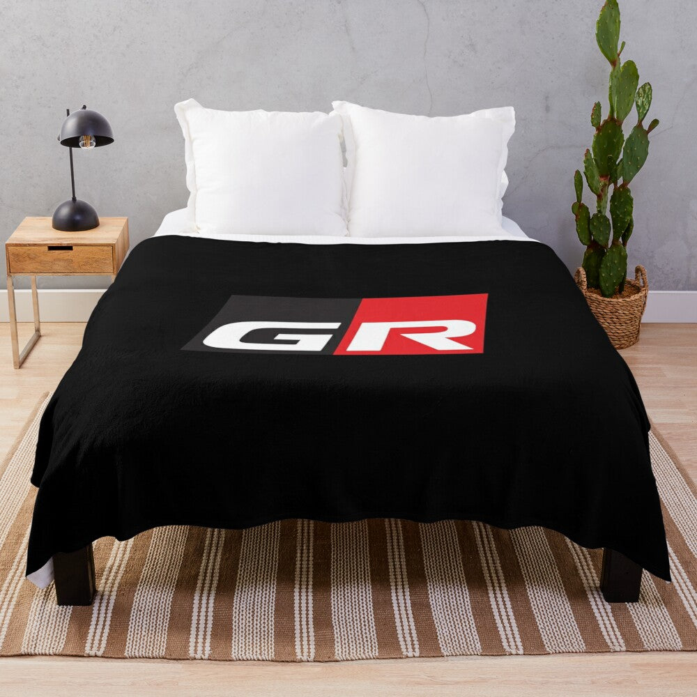 Gazoo Racing inspired plush blanket with GR logo and Toyota GR models