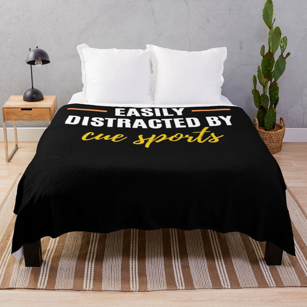 Plush blanket with text "Easily Distracted By Cue Sports"