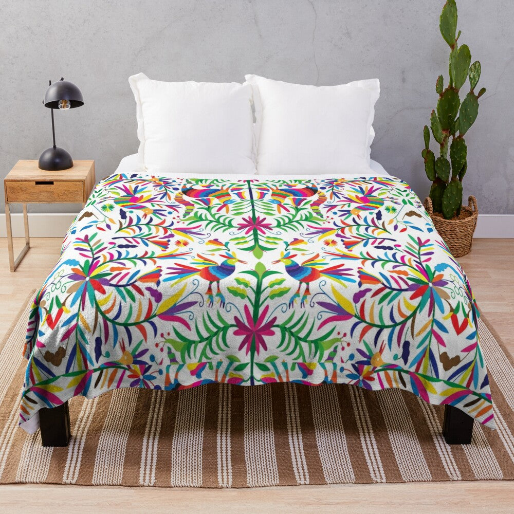 Otomi-inspired colorful plush blanket with vibrant floral and geometric patterns