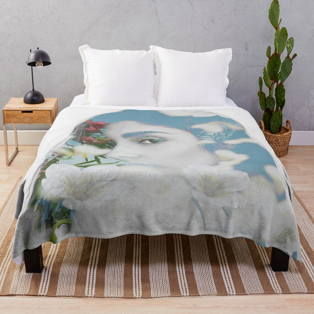 Floral silhouette plush blanket with a subtle Latina woman design