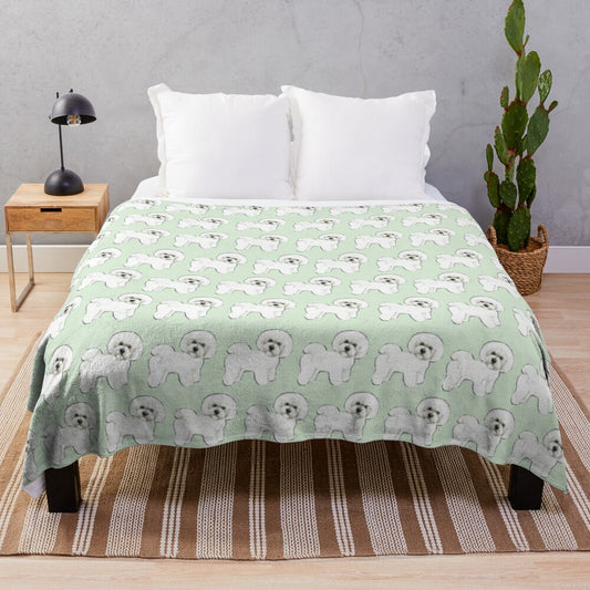 Bichon frise dogs on a mint green plush blanket