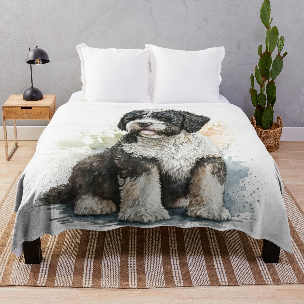 Watercolor painting of a Portuguese water dog on a plush blanket