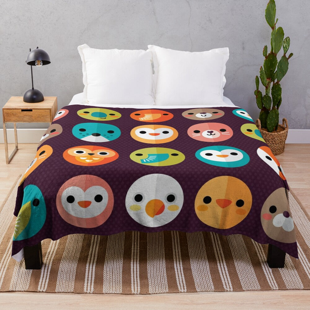 Smiley faces and cute animal designs on a soft, plush blanket