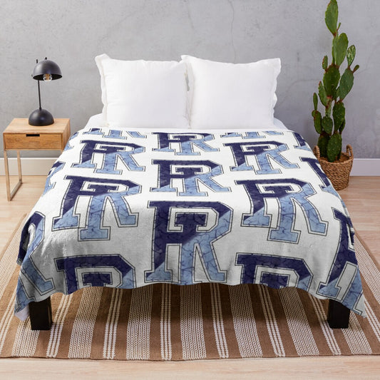 Marbled plush blanket featuring the University of Rhode Island Rhody Rams logo