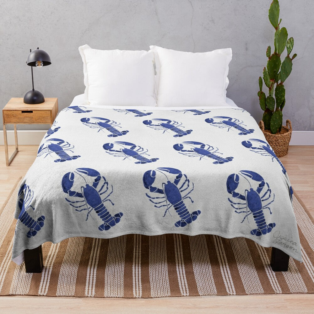 Watercolor lobster design on navy plush blanket