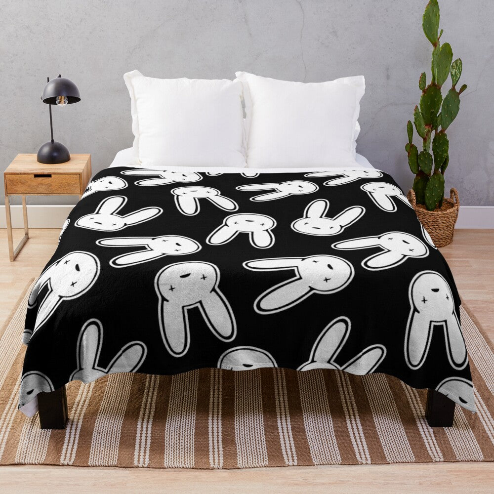 Black and white plush blanket featuring the Oasis logo design associated with Bad Bunny