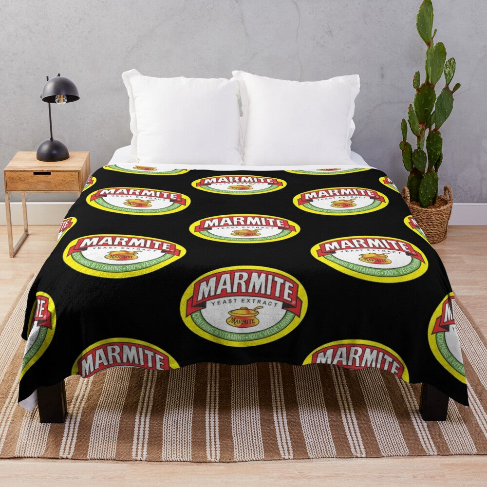 Marmite logos plush blanket, featuring the iconic Marmite logo design