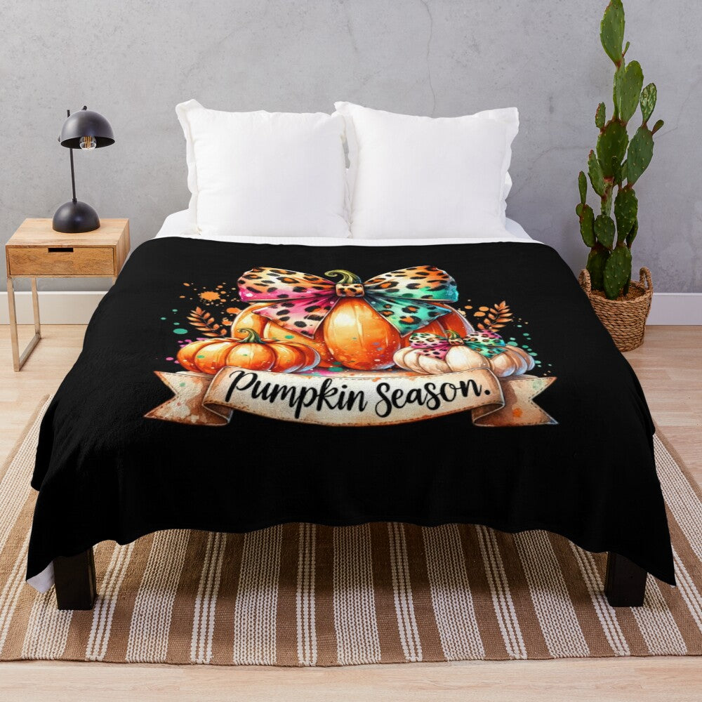 Whimsical watercolor pumpkin illustration on a cozy plush blanket for fall decor