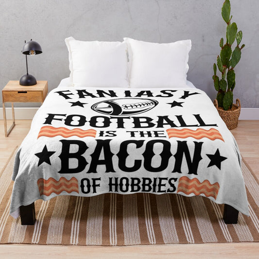 Soft plush blanket with a retro "Fantasy Football is the Bacon of Hobbies" design, great for football fans and collectors.