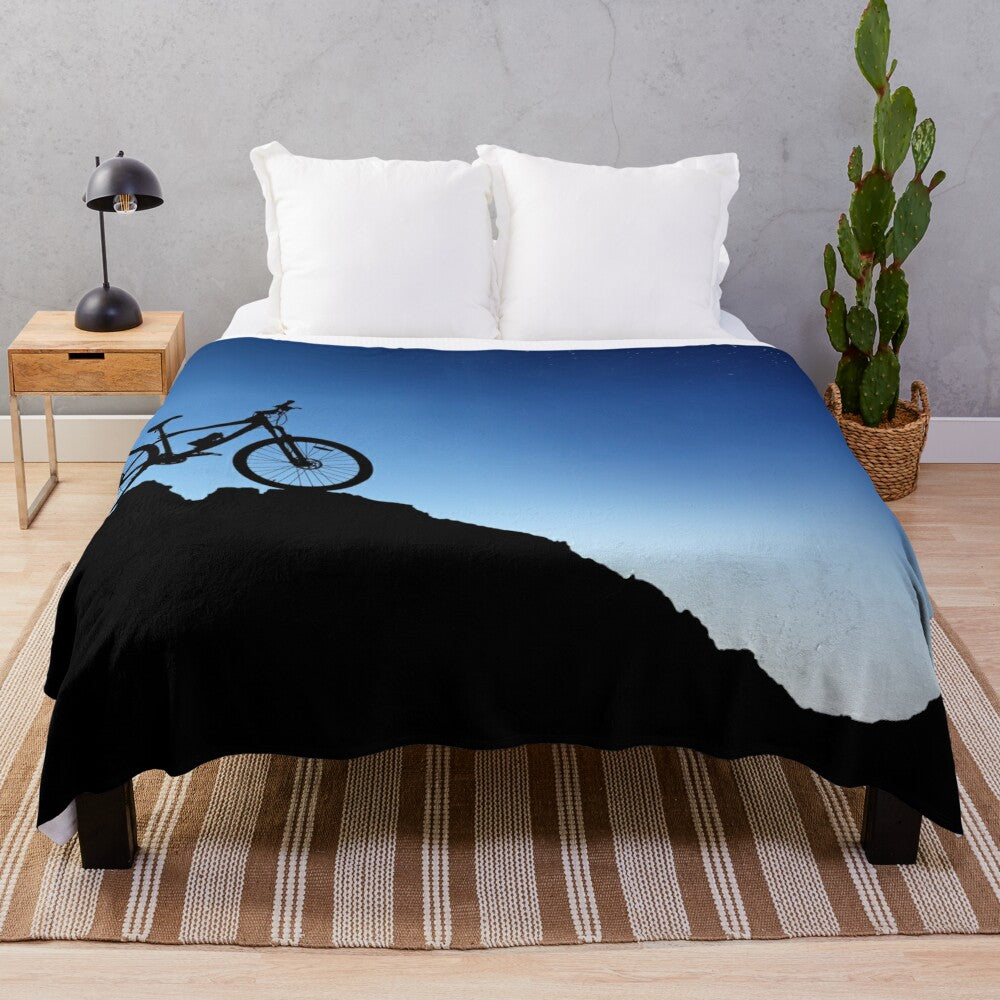 Mountain biking plush blanket with blue sky silhouette