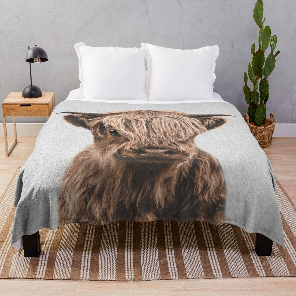 Soft and cuddly plush blanket featuring a cute highland calf design