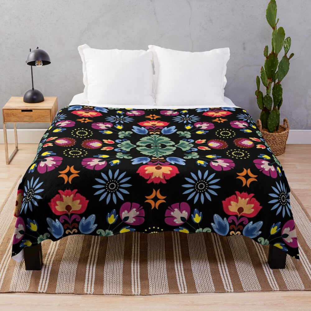 Fiesta folk inspired black plush blanket with abstract floral pattern