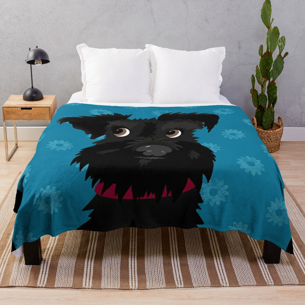 Black miniature schnauzer dog with blue daisies on a plush blanket