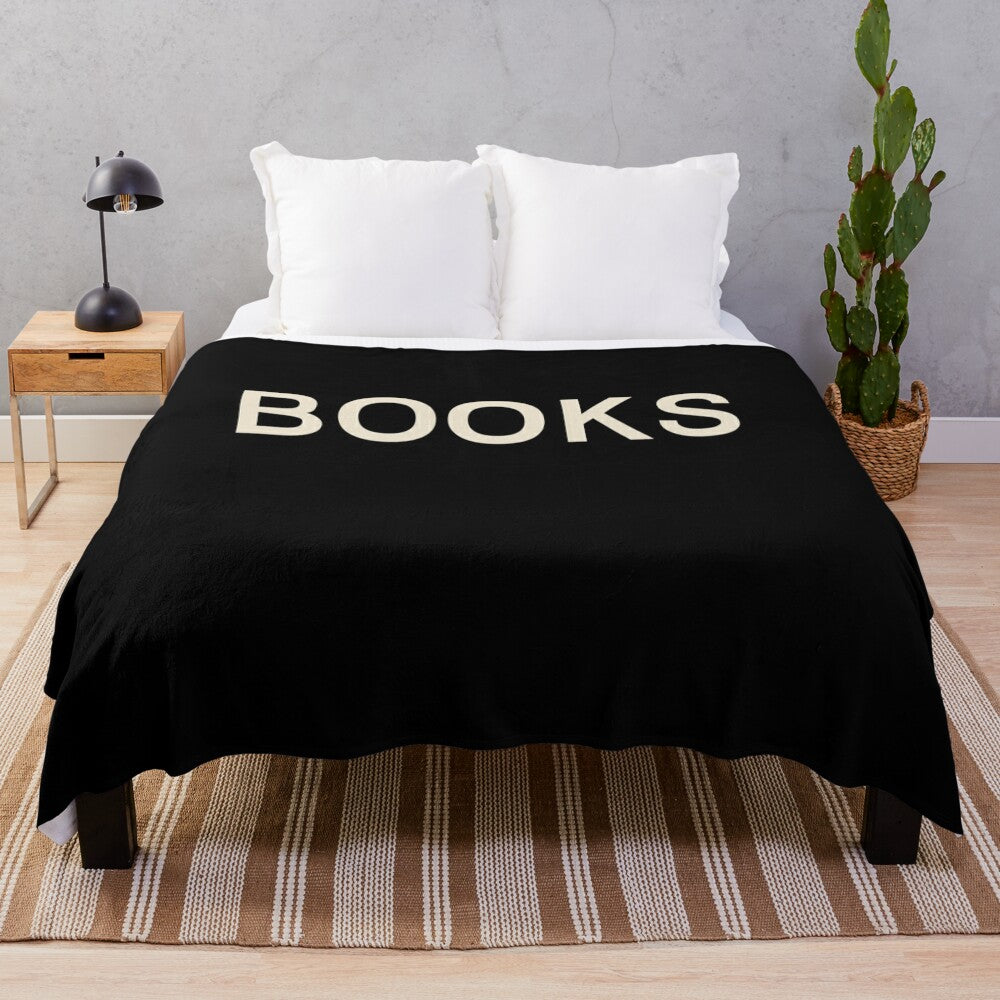 Plush blanket with books, reading, and literary-themed design