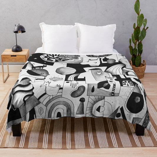 Plush blanket with abstract adventure-themed design