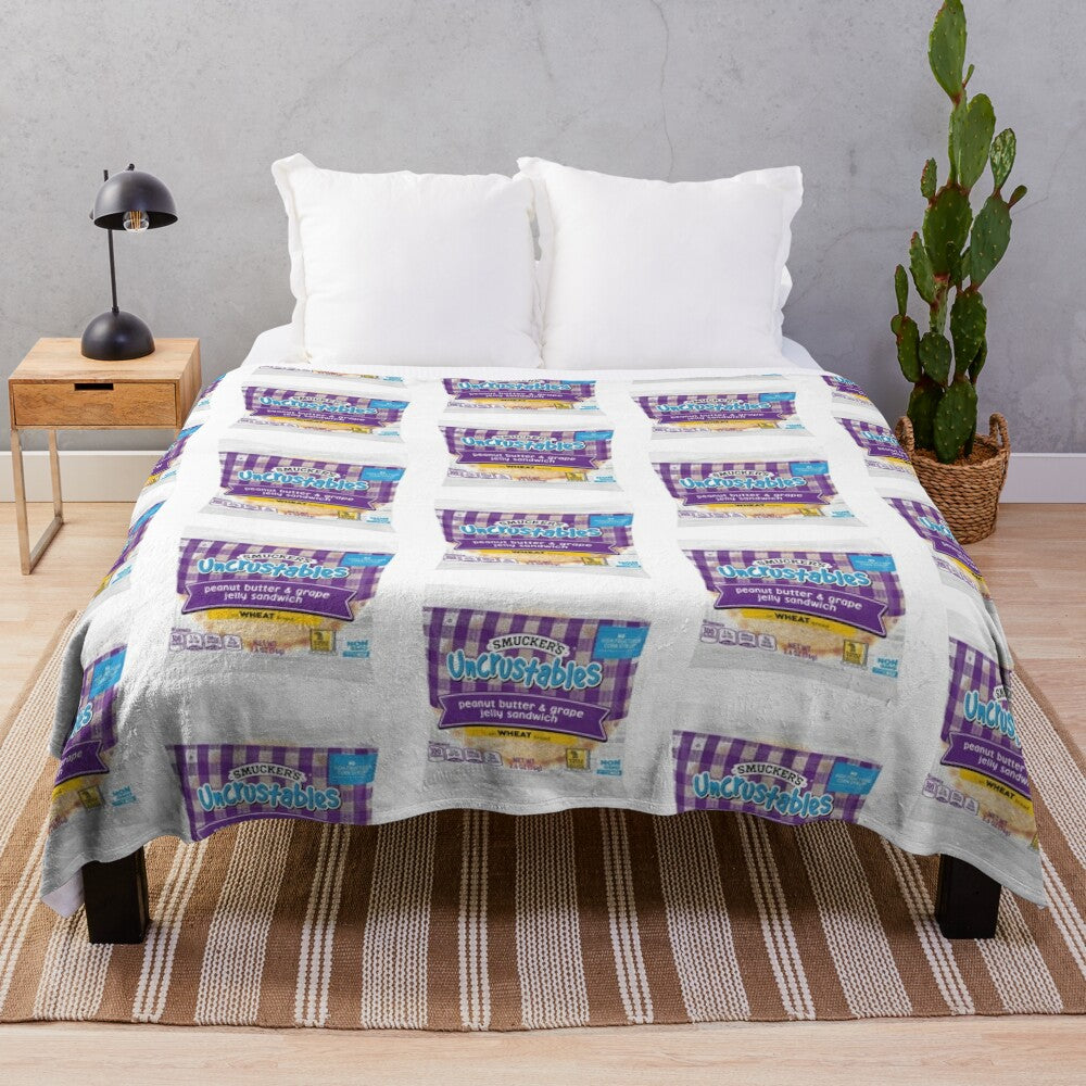 Uncrustables-inspired plush blanket with peanut butter and grape jelly design