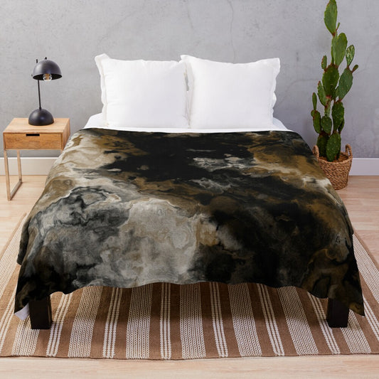 Abstract black and white plush blanket with gold accents