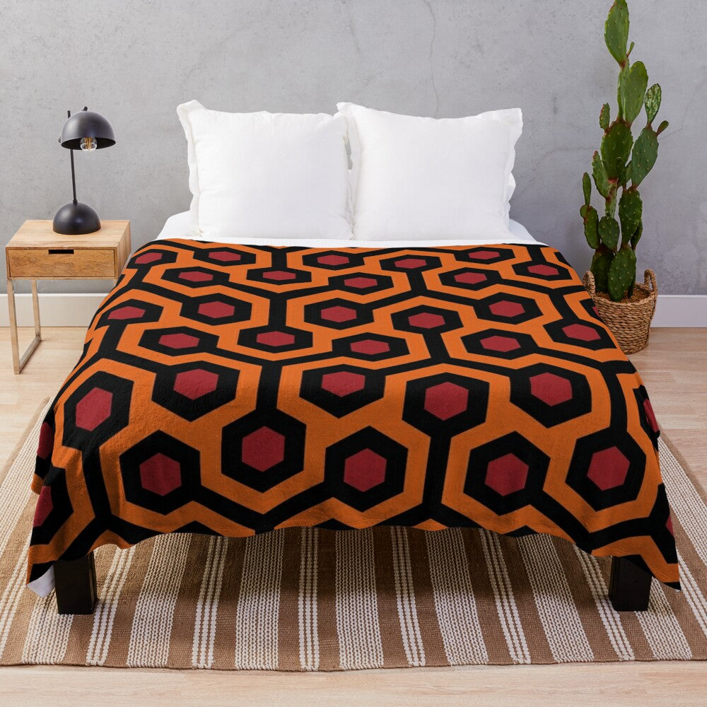 Geometric and abstract plush blanket featuring the iconic Overlook Hotel carpet pattern