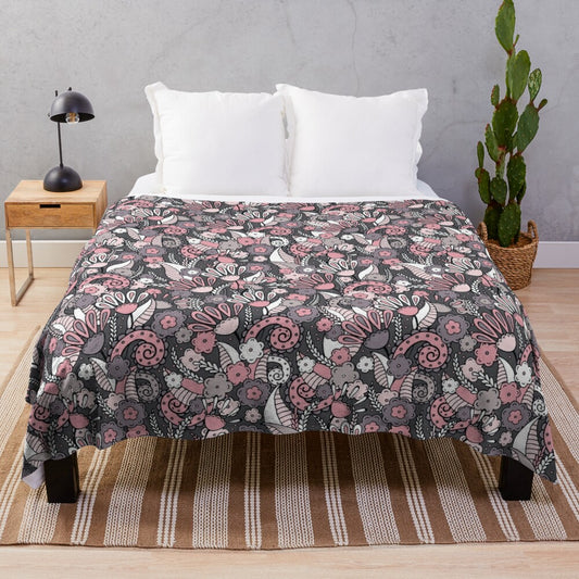 Soft, plush blanket featuring a doodle floral pattern on a gray-brown background