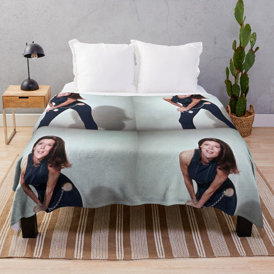 Soft, cozy plush blanket featuring the iconic image of actress Diana Rigg