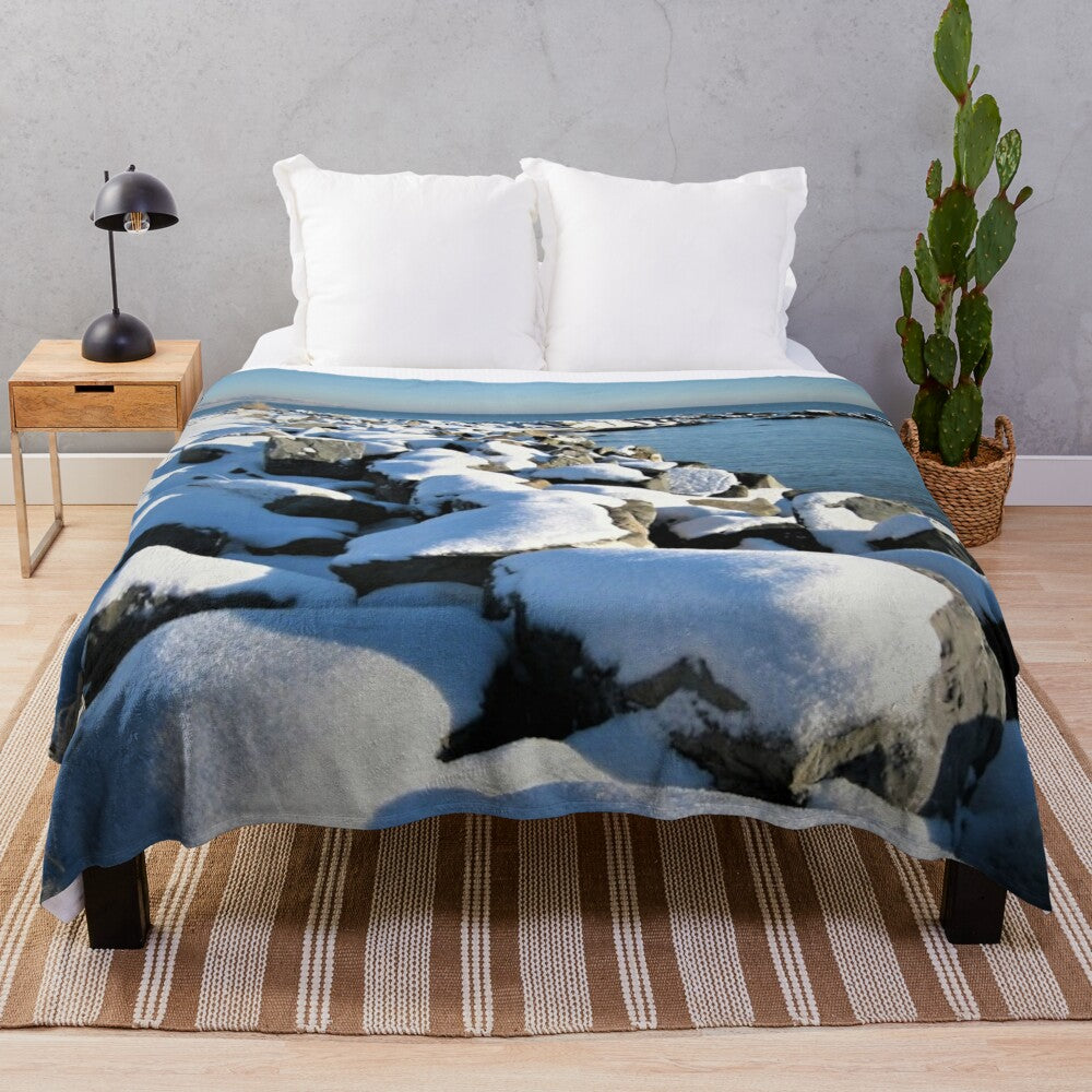 Snowy Irish seashore landscape printed on a soft, plush blanket