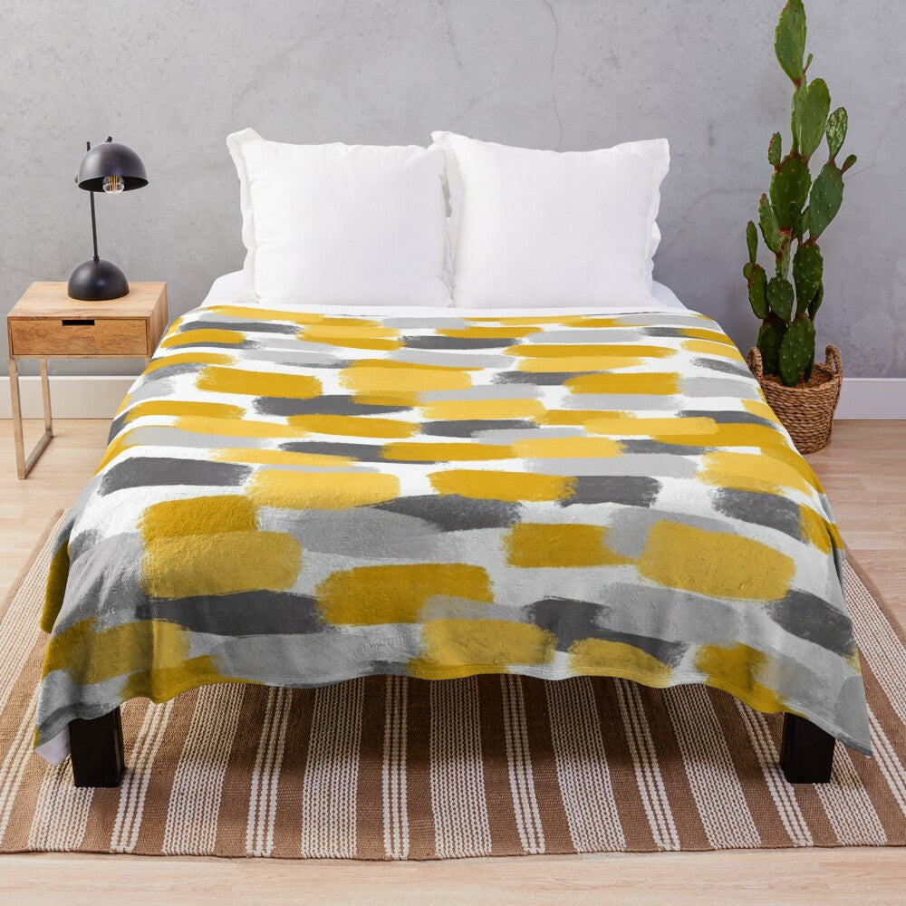 Grey and mustard yellow abstract paint brush effect plush blanket