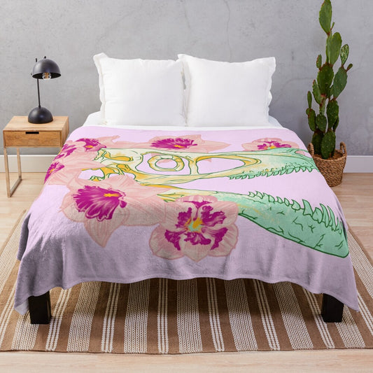 Pastel plush blanket featuring a velociraptor skull surrounded by spring flowers