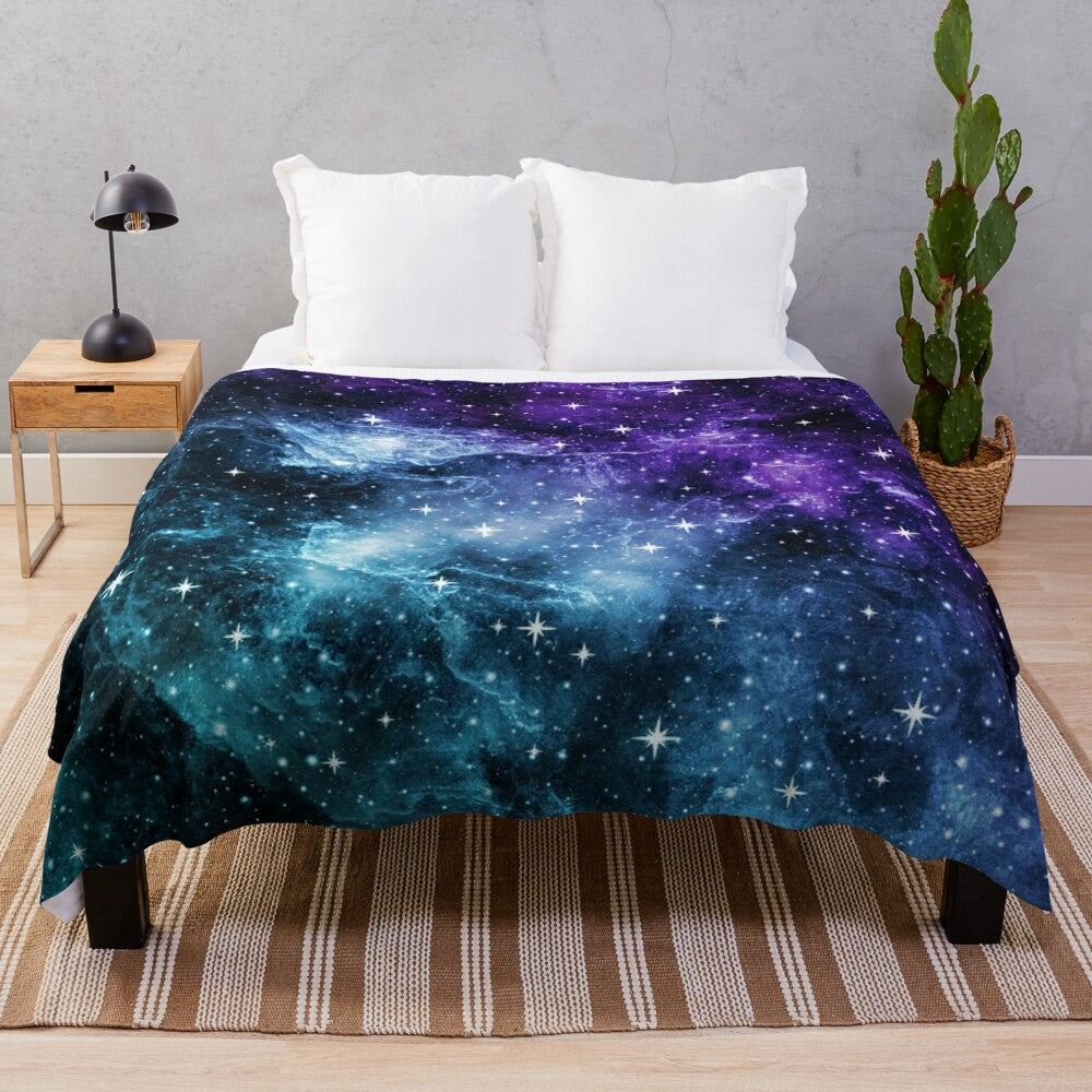 Purple and teal galaxy nebula plush blanket with stars and cosmic design