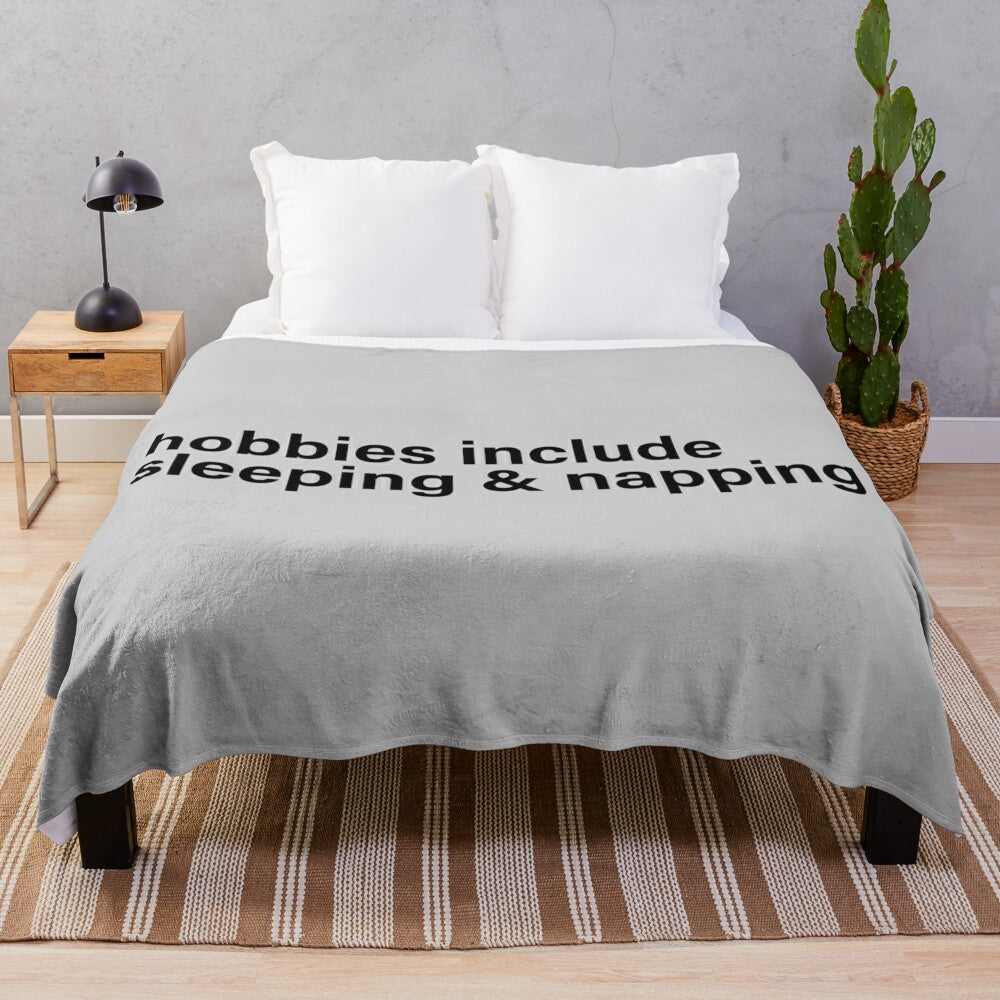 Plush blanket with "Hobbies Include Sleeping and Napping" funny text design