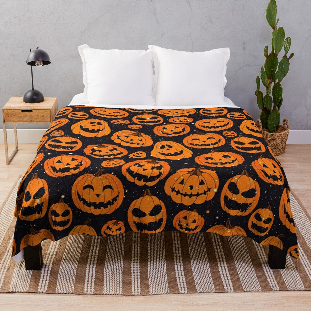 Plush blanket featuring smiling pumpkins on a starry night background