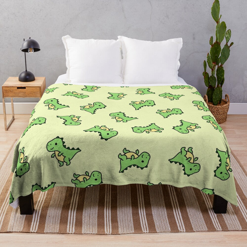 Cuddly T. Rex plush blanket with a green and teal color scheme