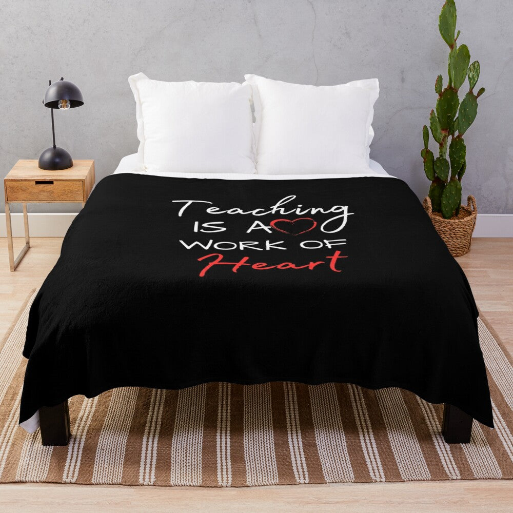 Plush blanket with the inspirational quote "Teaching Is A Work Of Heart"