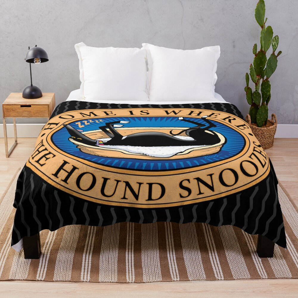 Greyhound, whippet, or lurcher dog sleeping on a soft, plush blanket with a cartoon design