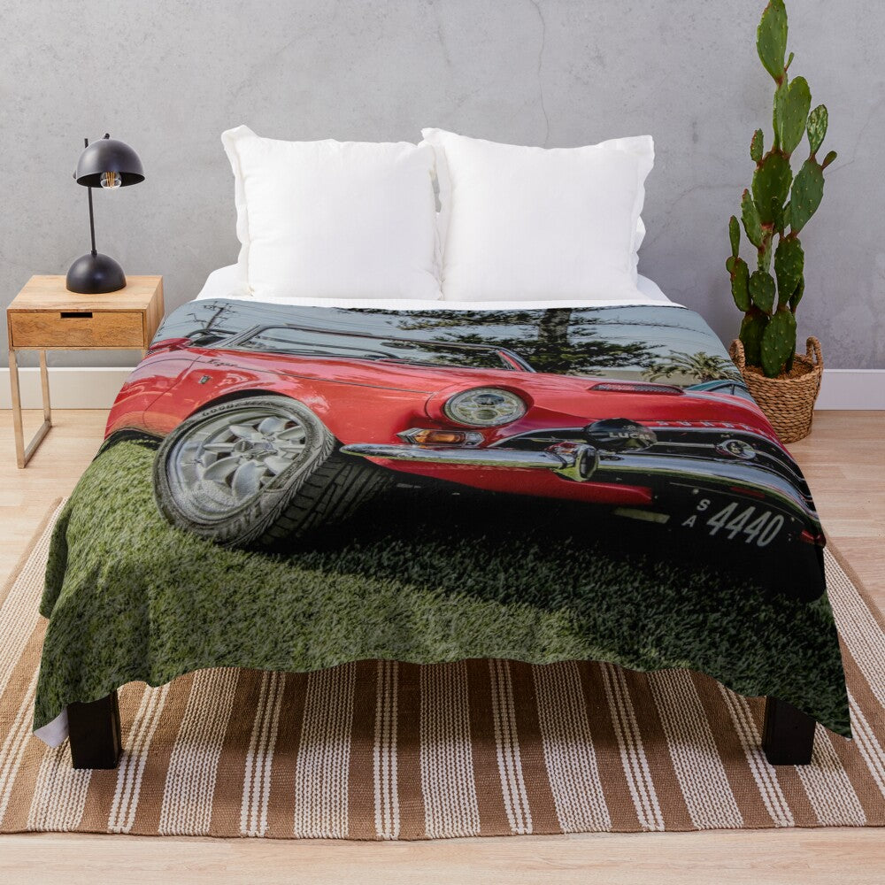 Red plush blanket with the image of a classic Sunbeam Tiger sports car