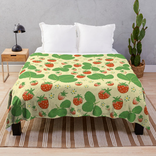 Vintage-inspired plush blanket with a repeating strawberry and floral pattern