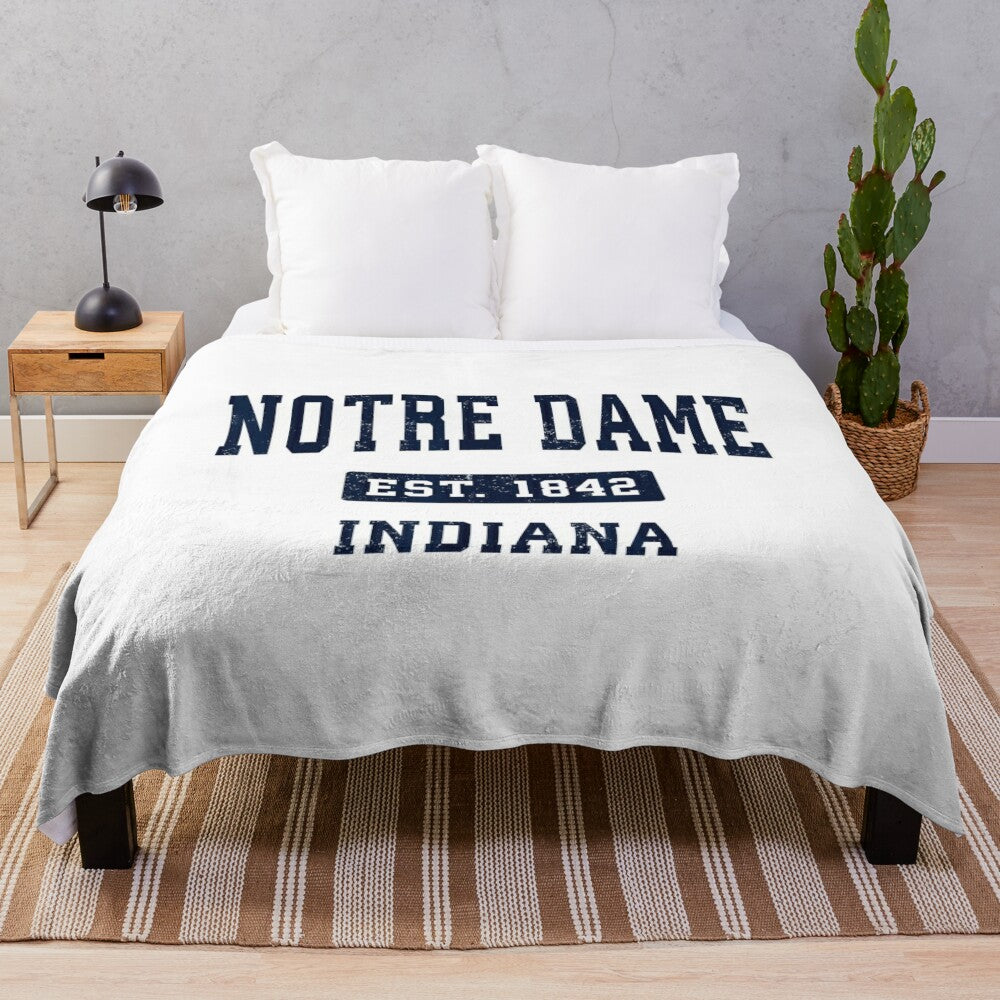 Vintage-style Notre Dame University plush blanket with athletic navy sports design