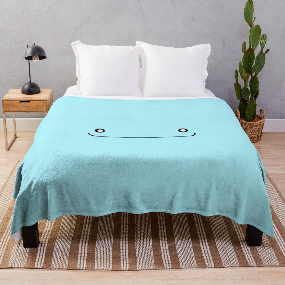 Wooper-inspired plush blanket with the iconic gen 2 Pokemon head silhouette