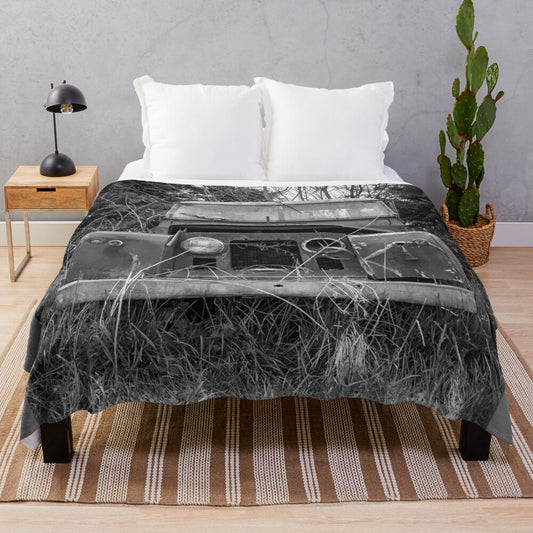 Vintage-inspired black and white plush blanket featuring a Land Rover design