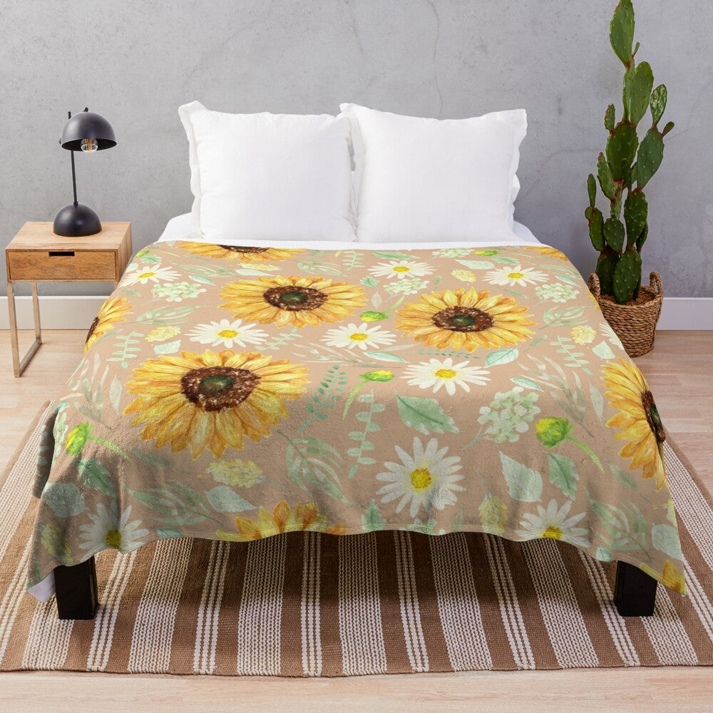 Watercolor sunflower and daisy floral pattern on a beige plush blanket