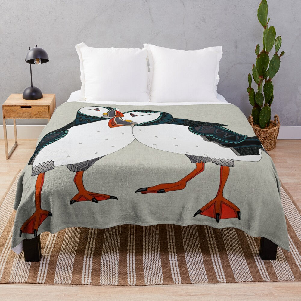 Warm grey plush blanket with a puffin bird design, perfect for nature lovers and cozy home decor.