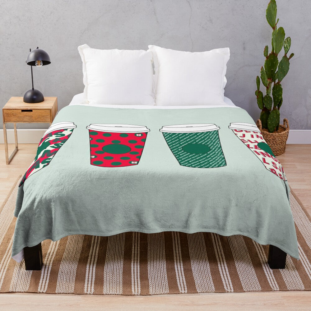 Holiday-themed plush blanket with coffee cup design