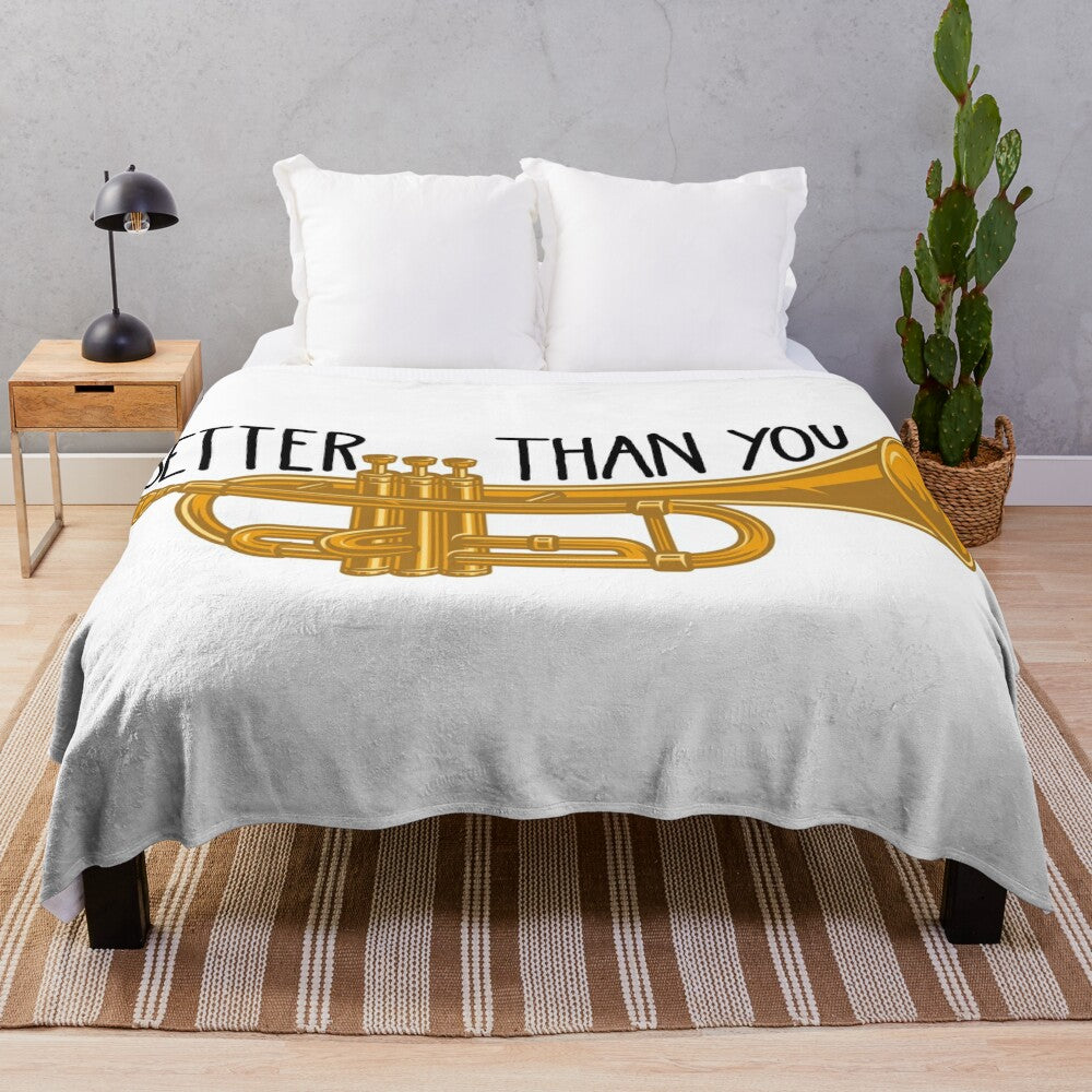 Plush blanket featuring trumpets and band-themed design