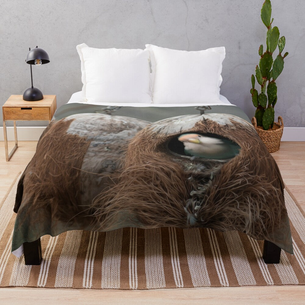 Plush blanket with colorful birds, nests, and other natural elements