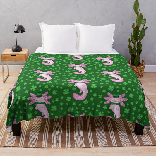 Cozy green and white plush blanket featuring an adorable axolotl design and clover pattern