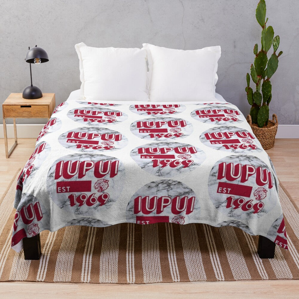 IUPUI-inspired plush blanket with a marble-like design in red and white